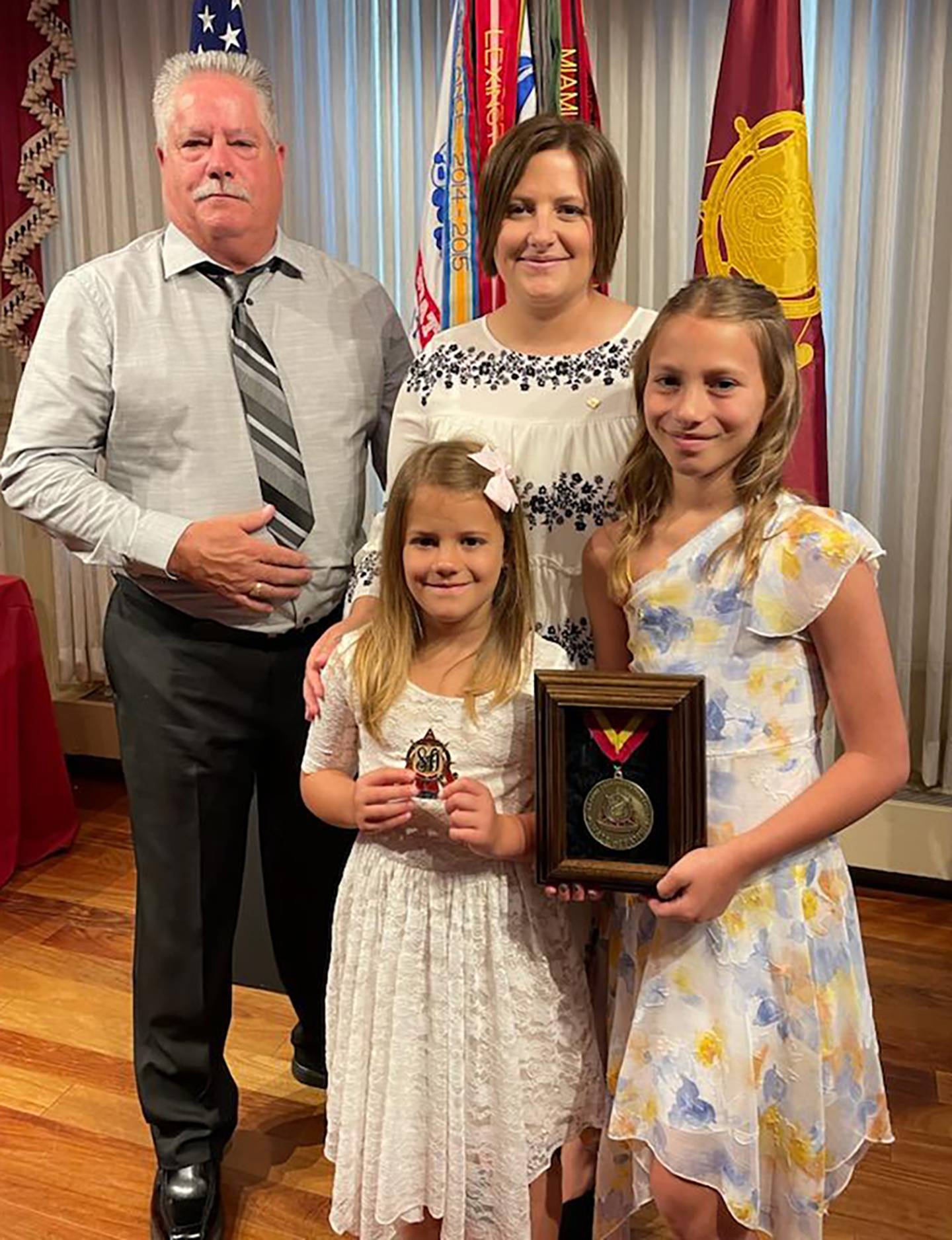 Terry Jones Sr., retired sergeant first class is joined by his son's surviving family — daughters Candace and Evelyn and wife Amy. Terry Jones II received a posthumous induction into the U.S. Army Transportation Corps Hall of Fame on July 29 at Fort Lee, Virginia. Jones served with the 1644th Transportation Company based at Rock Falls during his 15 years in the Illinois Army National Guar