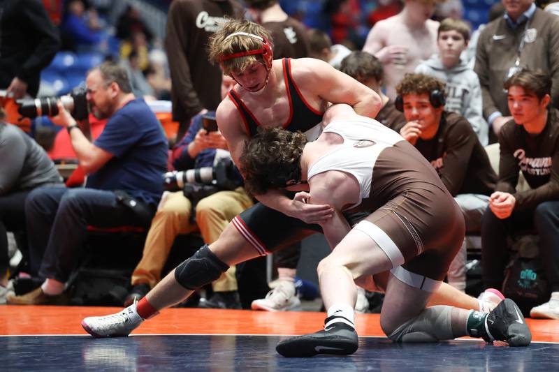Yorkville’s Luke Zook works over Mount Carmel’s Colin Kelly in the Class 3A dual state championship on Saturday in February 2024 in Bloomington.
