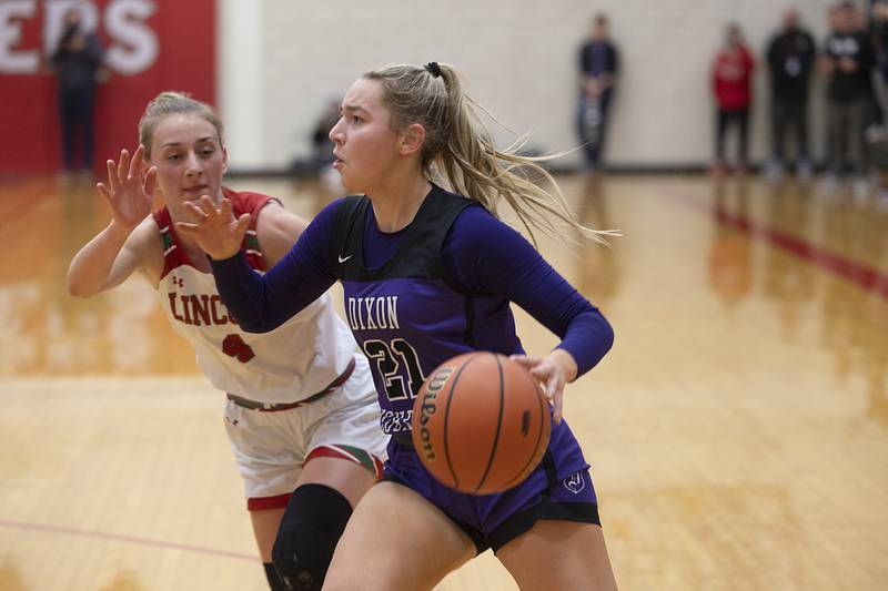 Dixon’s Reese Dambman handles the ball against Lincoln’s Becca Heitzig in the class 3A super sectional Monday, Feb. 26, 2024 at LaSalle-Peru High School.