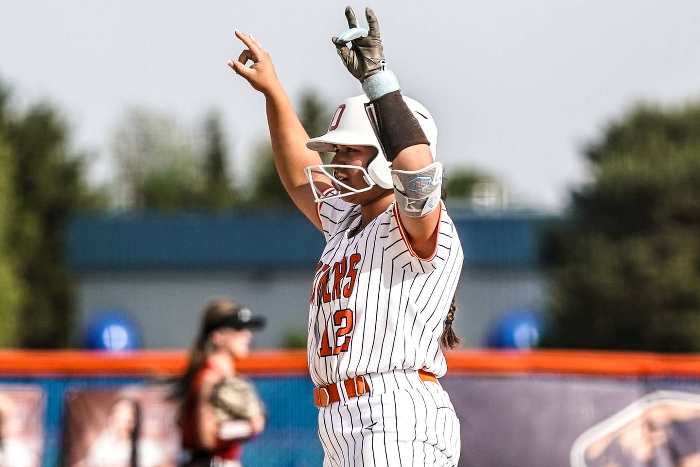 Oswego’s Aubriella Garza (12) celebrates after hitting a double against Yorkville during a softball game at Oswego High School on Thursday, May 15, 2025.