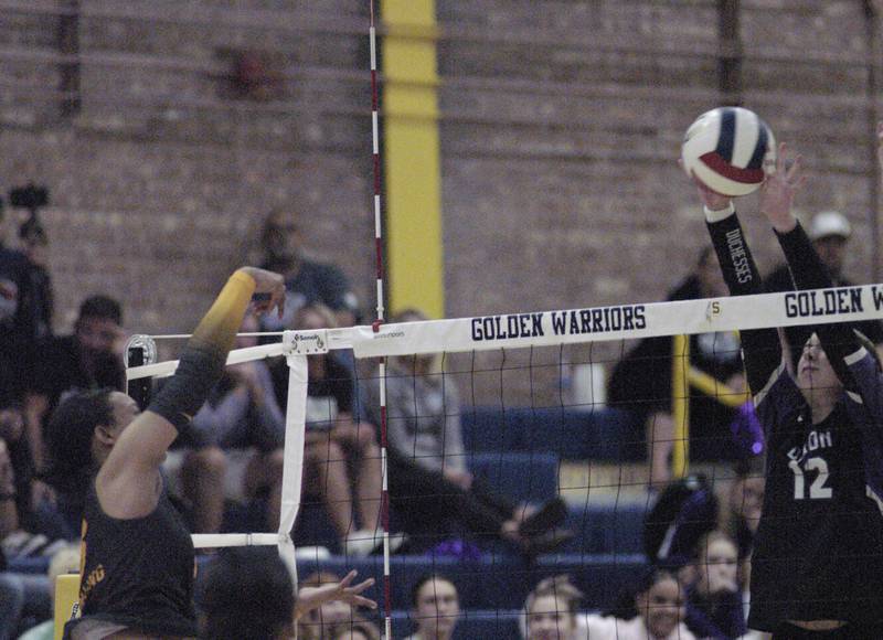 Volleyball hit by Sterling's Alasia Rascon is blocked by Dixon's Izzy Queckborner. Sterling hosted Dixon in Volleyball on August 26, 2025 at Musgrove Fieldhouse.