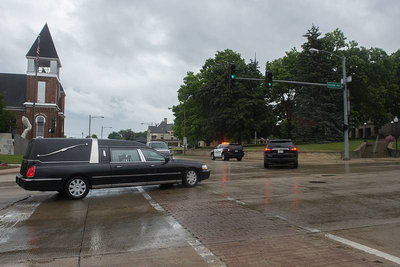 The funeral procession John Fritts turns past the old Lee County Courthouse Saturday, June 25, 2022 on its way to Oakwood Cemetery. Fritts, who was killed in a car crash last week served as treasurer of Lee County along with being a farmer, 4H advisor and sports official.