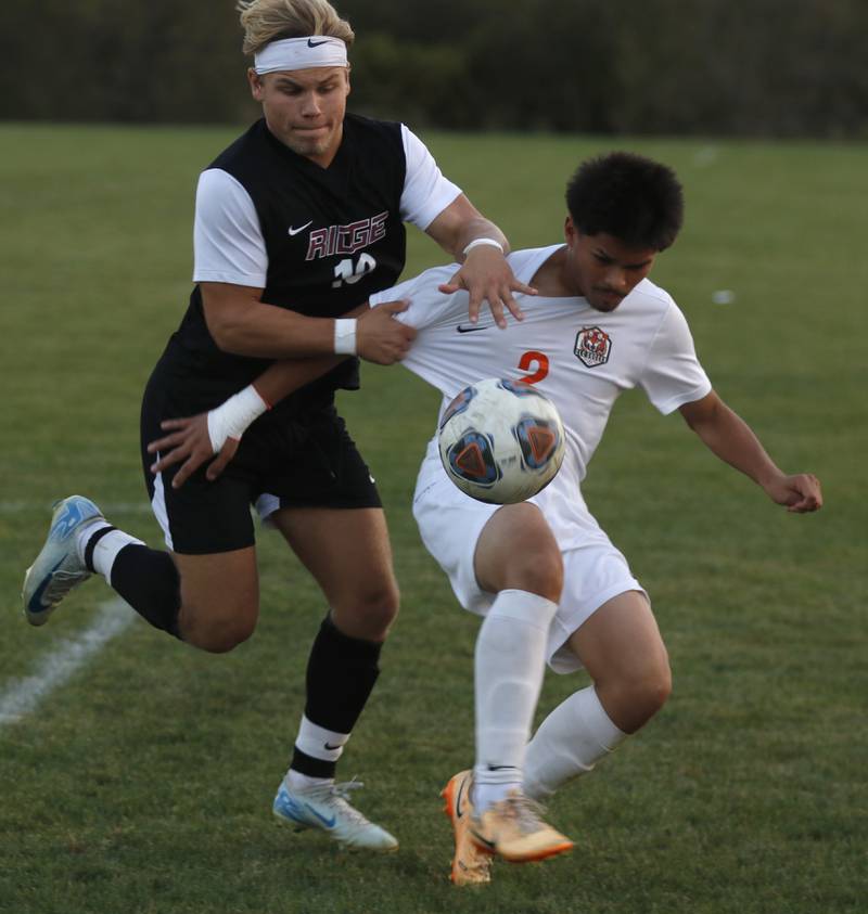 Prairie Ridge's Gabriel Porter battles with Crystal Lake Central's Joshua Hernandez for the ball during a Fox Valley Conference soccer match on Thursday, Oct. 10, 2024, at Prairie Ridge High School.
