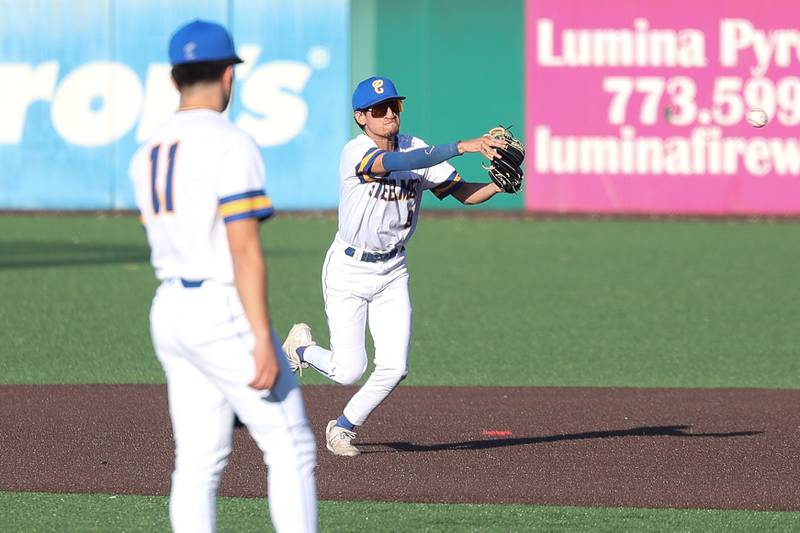 Joliet Central’s Nathan Maldonado throws to first for the out against Aurora East on Monday, Mar. 11th in Joliet.