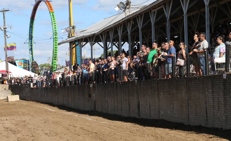 A large crowd stands for the National Anthem before th Demolition Derby during the 170th annual Bureau County Fair on Saturday, Aug. 23, 2025 in Princeton.