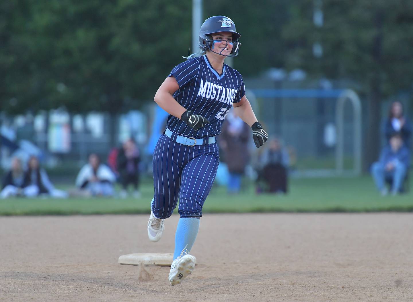 Downers Grove South’s Jacklyn Meyers rounds second base after hitting a home run during a game against Downers Grove North on May 14, 2026 at McCollum Park in Downers Grove .