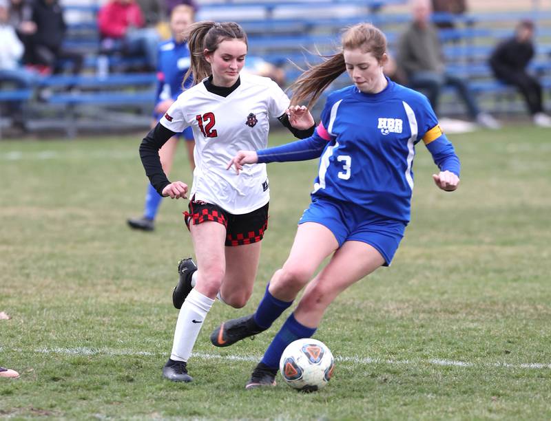 Hinckley-Big Rock-Somonauk’s Alyssa Swanson holds off Indian Creek's Emma Turner during their game Monday, April 3, 2023, at Hinckley-Big Rock High School.