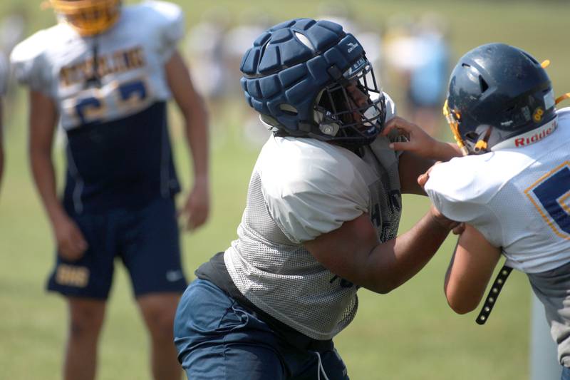 Oswego East’s Connor Griffin runs a drill during a joint practice with Sterling and Glenbard South football teams on Tuesday, July 15, 2025 in Oswego.