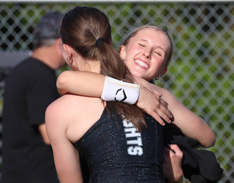 Kaneland’s Grace Moreno (left) and Delainey Baran hug after both qualified for state in the pole vault Friday, May 15, 2026, during the Class 2A girls track sectional at Genoa-Kingston High School.