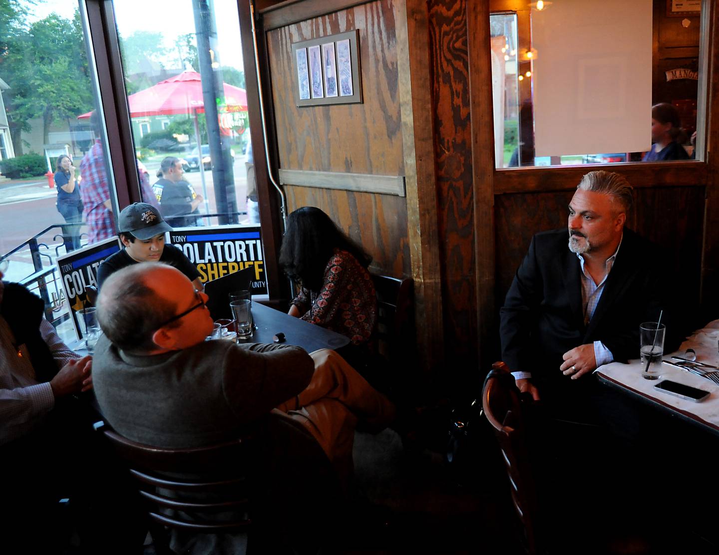 Tony Colatorti, right, talks with supporters during his primary election night watch party Tuesday June 28, 2022, at Cucina Bella, 220 S. Main St. in Algonquin. Colatorti, who owns Cucina Bella, was one of two  Republican candidates running to become McHenry County’s next sheriff.