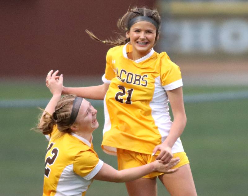Jacobs’ Kylie Deegan, right, celebrates her goal with teammate Clare Leib against Hampshire in varsity girls soccer on Thursday, April 17, 2025, at Jacobs High School in Algonquin.