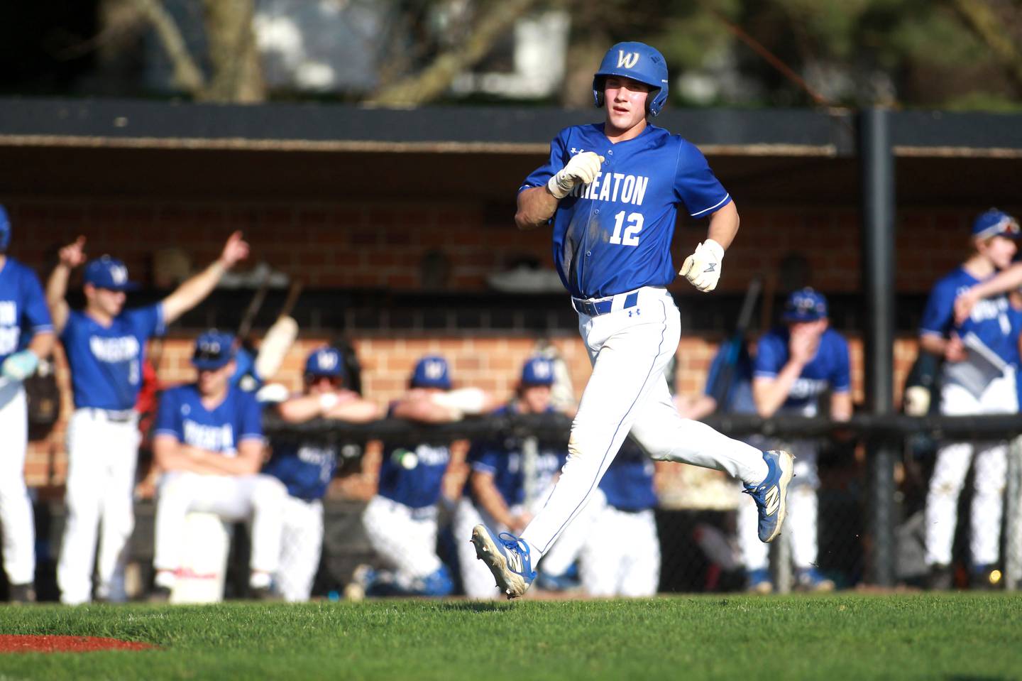 Wheaton North's Nic Pisciotta runs home during a game against St. Charles East on Wednesday, April 23, 2025 in St. Charles.