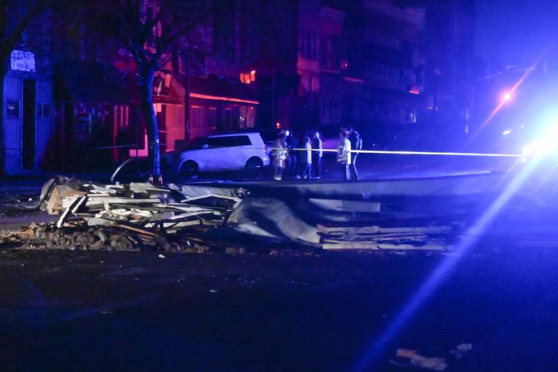 Rubble is seen near the Apollo Theatre, early Saturday, April 1, 2023, after a severe spring storm caused damage and injuries, in Belvidere, Ill. (AP Photo/Matt Marton)