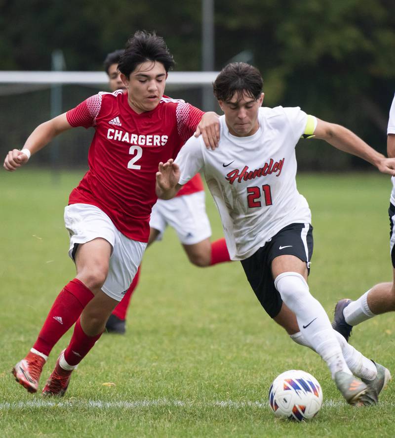 Dundee-Crown's Gabriel Herrera and Huntley's Zach Heitkemper battle for a loose ball during their game on Thursday, October 6, 2022 at Dundee-Crown High School in Carpentersville. Dundee-Crown won 1-0.