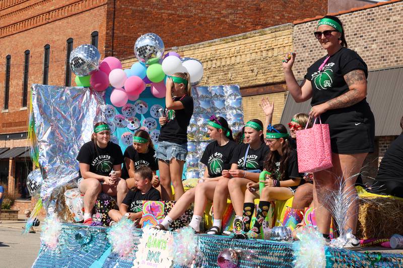 The St. Anne Grade School girls basketball team rides along in the Grand Pumpkin Parade during the St. Anne Pumpkin Festival on Saturday, Oct. 4, 2025.