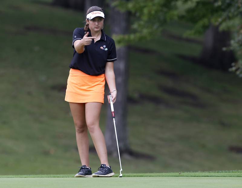 Crystal Lake Co-op’s Addison Cleary tries to coax her putt on15th green during the Fox Valley Conference Girls Golf Tournament Wednesday, Sept. 20, 2023, at Crystal Woods Golf Club in Woodstock.