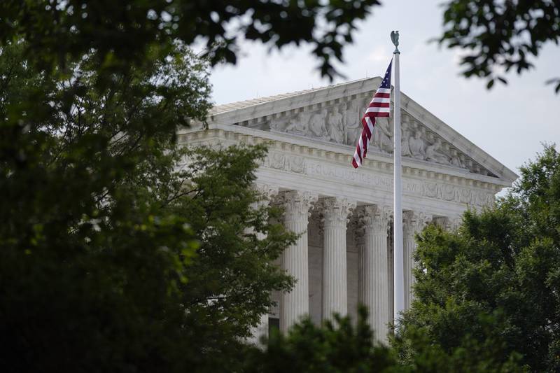 An American flag waves in front of the U.S. Supreme Court building, Monday, June 27, 2022, in Washington. (AP Photo/Patrick Semansky)