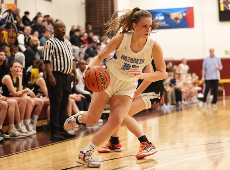 Nazareth's Gracie Carstensen (22) heads to the basket during the girls 3A varsity super-sectional game between Nazareth Academy and Fenwick High School in River Forest on Monday, Feb. 27, 2023.