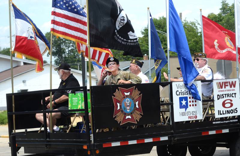 Vetetans ride on the Oregon VFW/American Legion float during the Let Freedom Ring parade on Friday, July 4, 2025 in Mt. Morris.
