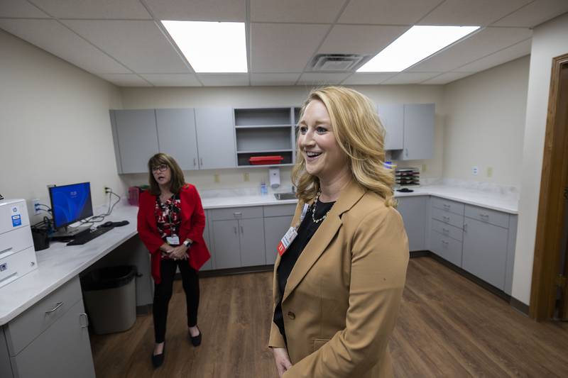 Nancy Varga (left) and Jessica Dowdall talk about what the OSF Saint Katharine clinic in Sterling has to offer Wednesday, Oct. 8, 2025, during the blessing and dedication. The medical center is located at XXX