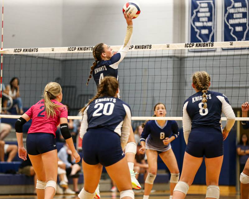 IC Catholic Prep's Ava Falduto (4) tips the ball over the net during volleyball match between Nazareth at IC Catholic Prep.  Aug 29, 2023.