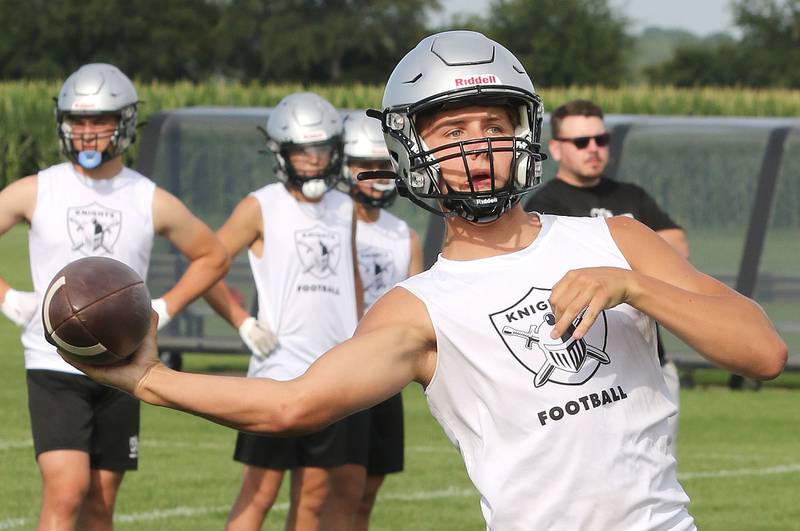 Kaneland quarterback Troyer Carlson fires a pass during 7-on-7 drills against DeKalb Tuesday, July 26, 2022, at Kaneland High School in Maple Park.