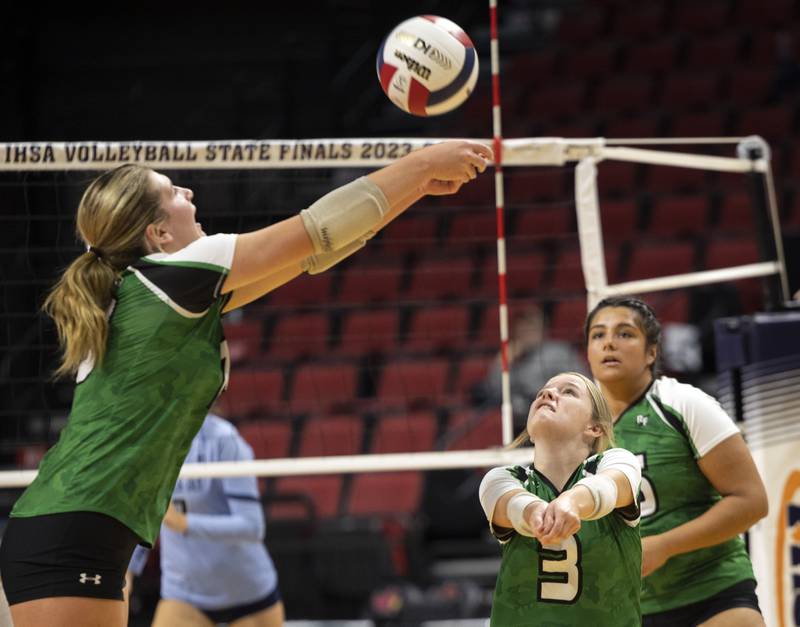 Rock Falls’ Claire Bickett (left) plays the ball over head of Zoe Henson against Breese Mater Dei in the 2A state semifinal Friday, Nov. 10, 2023 at CEFCU Arena in Normal.