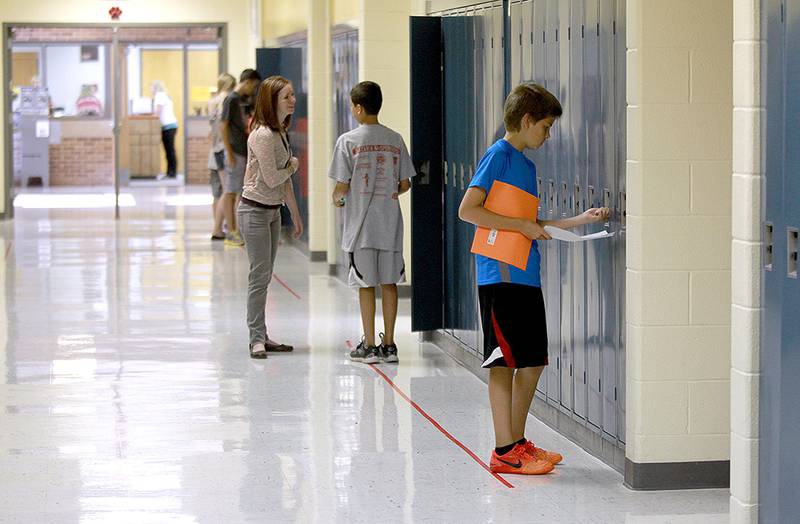 Students arrive for the first day of school at Rotolo Middle School in Batavia Tuesday 
morning.(Sandy Bressner photo)
