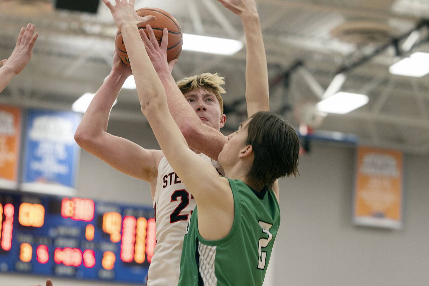 Fulton’s Ethan Price puts up a shot against Scales Mound’s Dylan Slavenburg Friday, March 3, 2023 in the 1A sectional final in Lanark.