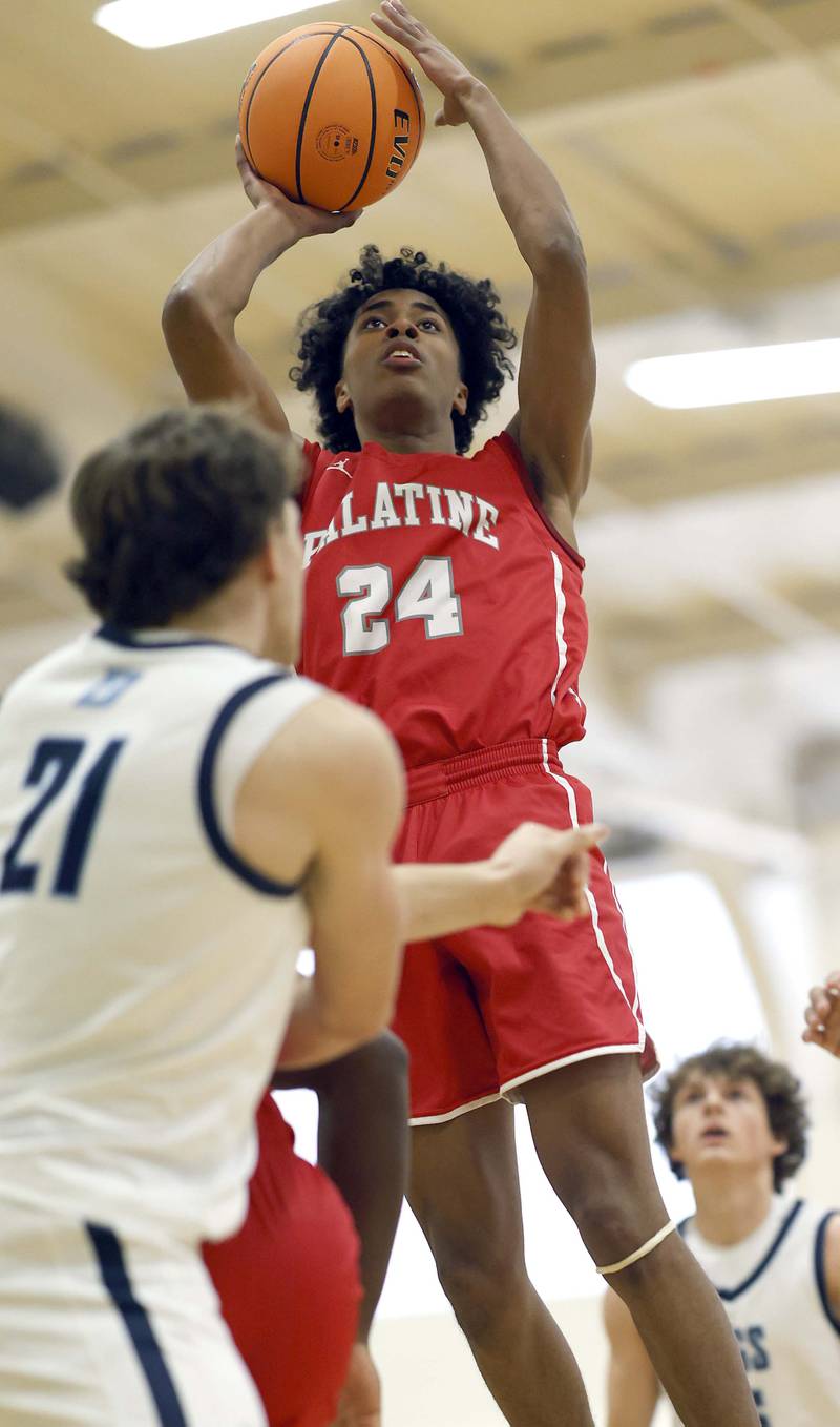 Palatine’s Abram Williams (24) shoots over Downers Grove South’s Daniel Laurich (21) during the Jack Tosh Holiday Tournament Thursday, Dec. 26, 2024 at York High School in Elmhurst.