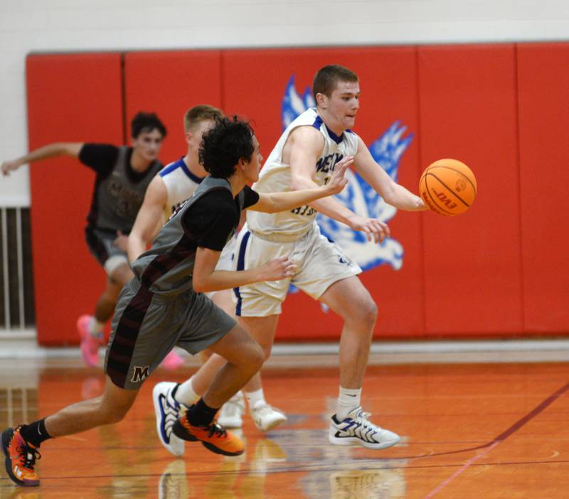 Newman's John Rowzee (23) knocks the ball away from a Harvard player on Friday, Nov. 29, 2024 at the Oregon Thanksgiving Tournament held at the Blackhawk Center in Oregon.
