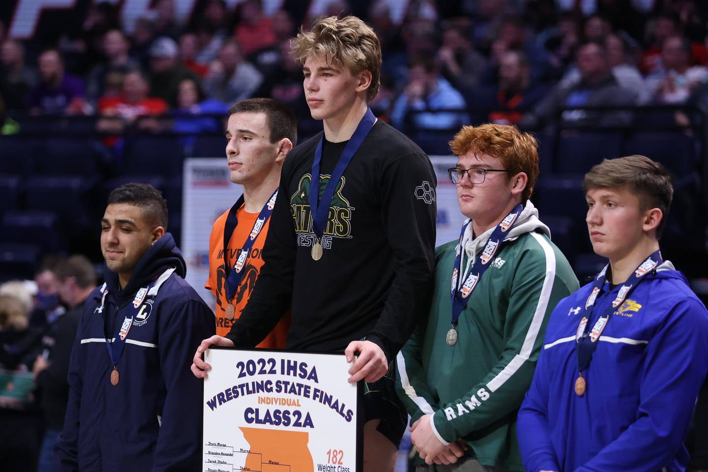 Crystal Lake South’s Shane Moran takes the podium as the Class 2A 182lb. champion at State Farm Center in Champaign. Saturday, Feb. 19, 2022, in Champaign.