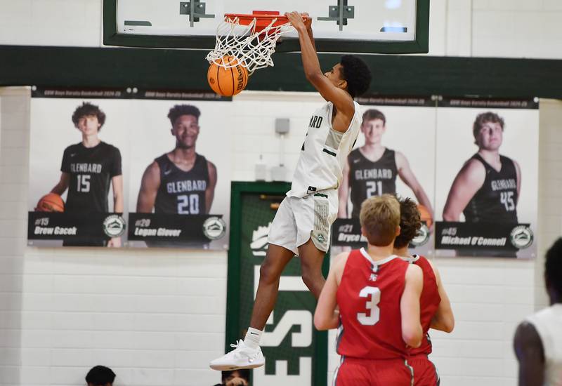 Glenbard West’s TJ Williams dunks the ball during a game against Hinsdale Central on January 31, 2025 at Glenbard West High School in Glen Ellyn.