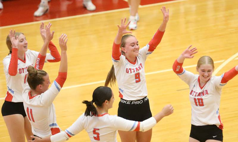 Members of the Ottawa volleyball team celebrate after scoring a point against Pontiac on Tuesday, Sept. 9, 2025 at Kingman Gymnasium.