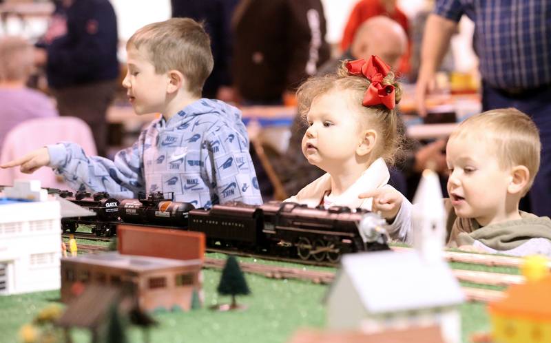 Wrnley Lange, Casey Ellberg and Aidyn Ellberg watch O Gauge Lionel trains during the Model Train and Toy Show on Saturday, Feb. 14, 2026 at the Bureau County Fairgounds in Princeton.