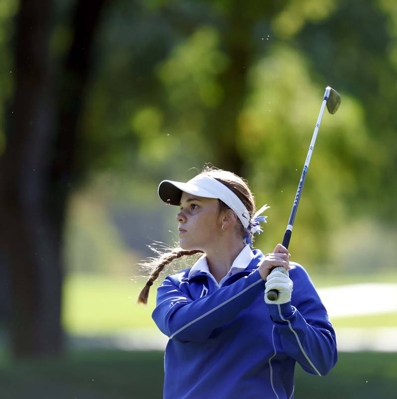 Hannah Grivetti of Wheaton St. Francis, watches her drive during the IHSA Class 2A West Chicago girls golf regional at St. Andrews Tuesday, Oct. 1, 2024 in West Chicago.