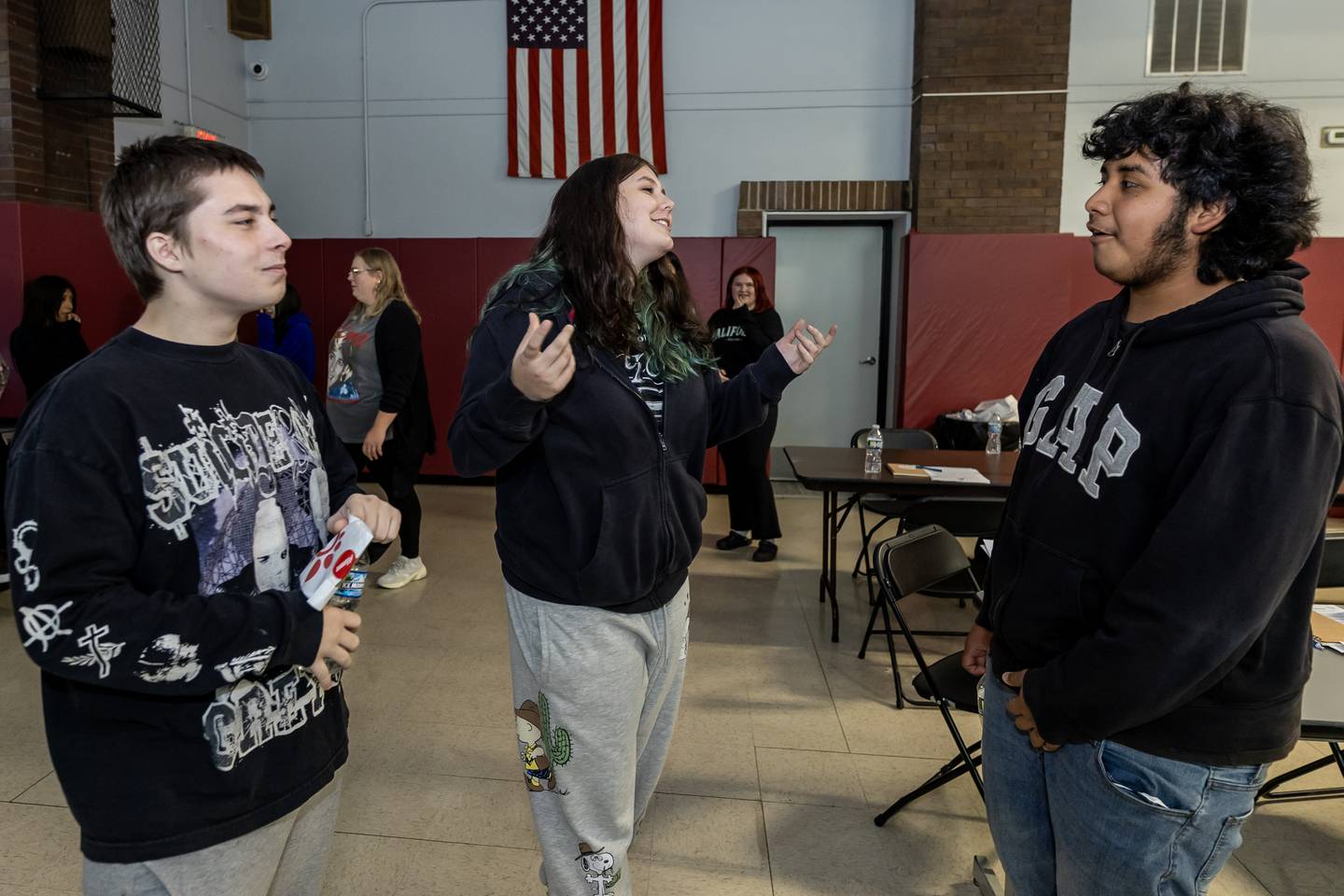 Tristan Bowling, Wesleigh Grant, and Louis Menieta participate in the ‘Swallow Your Fear’ activity, which involves eating a jellybean that could be delicious or disgusting, during the Chick-fil-A Leader Academy at Lincoln School on Sept. 9, 2025.