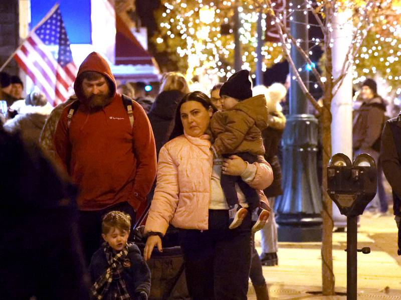 Visitors make their way down State Street to see the performers Friday, Nov. 22, 2024, during Moonlight Magic in downtown Sycamore.