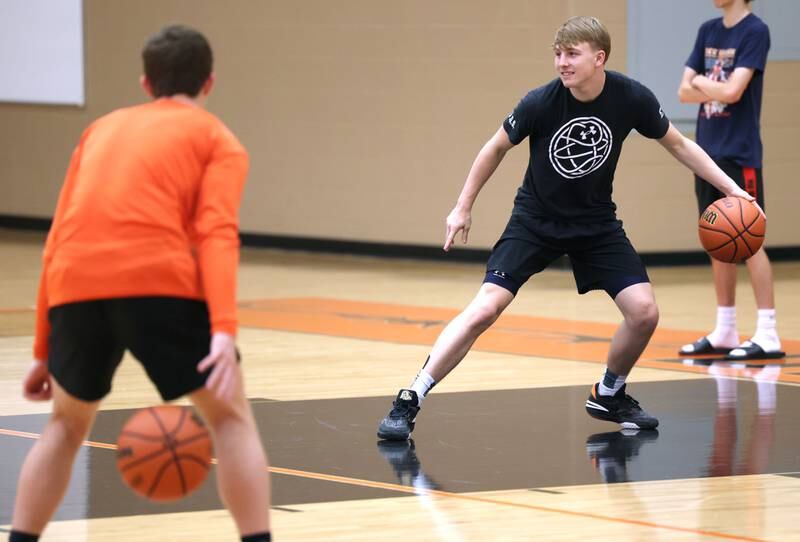DeKalb’s Sean Reynolds leads a ball handling drill during practice Monday, June 19, 2023, at DeKalb High School.