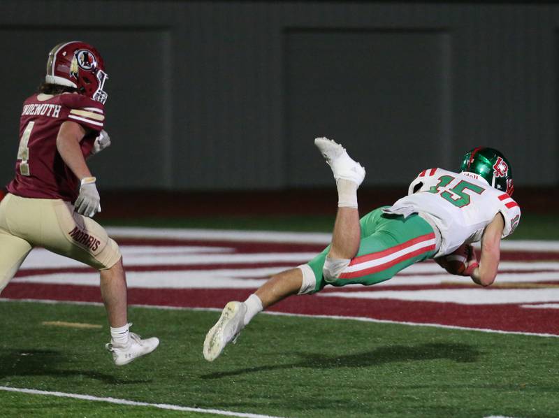 L-P's Brendan Boudreau (15) dives for the touchdown as Morris's Dimitri Lindermuth during the Class 5A round one football game on Friday, Oct. 28, 2022 in Morris.