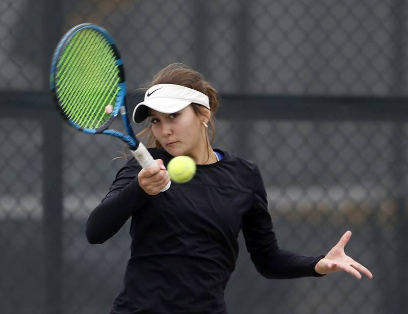 St. Charles North’s Danielle Dejanovich returns the ball Thursday, Oct. 19, 2023, during doubles match on the first day of the IHSA State Girls Tennis Tournament at Hoffman Estates High School in Hoffman Estates.