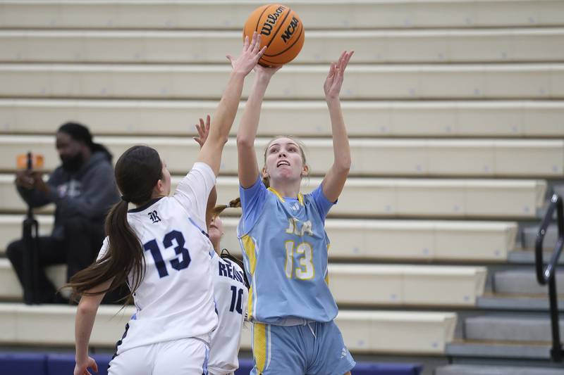 Joliet Catholic’s Abby Dulinsky puts up a shot against Reavis in the Peotone Blue Devils Holiday Classic championship game on Monday, Dec. 29, 2025 in Peotone.