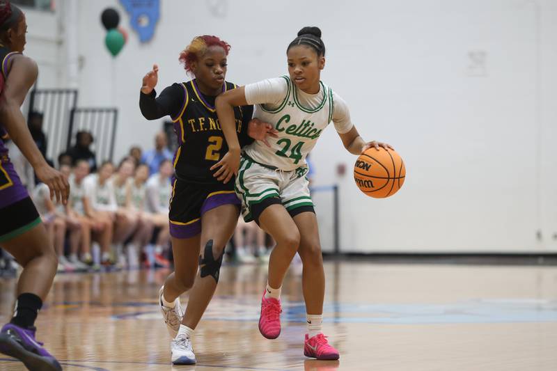 Providence’s Nina Herron drives around Thornton Fractional North’s Zyerra Rogers  in the Class 3A Hillcrest Sectional semifinal game on Tuesday, Feb. 24, 2026 in Hillcrest.