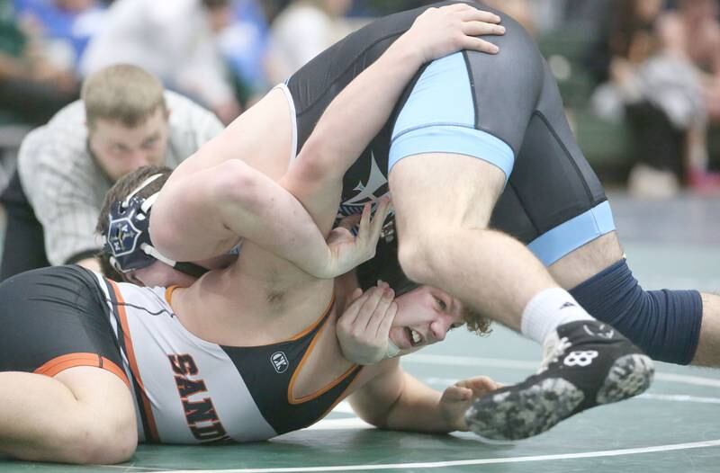 Sandwich's Kai Kern wrestles Marquette's Landyn McEmery in the 175 pound weight class during the Class 1A Regional meet on Saturday, Feb. 8, 2025 at St. Bede Academy.