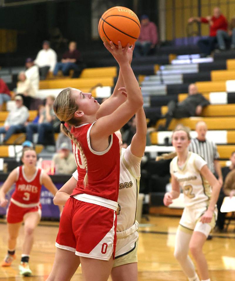 Ottawa's Ella Schmitz shoots over Sycamore's Layla Janisch during their game Friday, Jan. 10, 2025, at Sycamore High School.