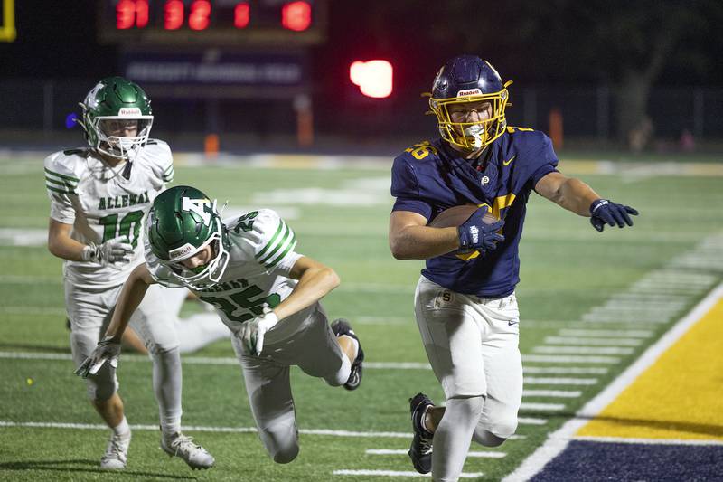 Sterling’s Brady McCray fights off a would-be Alleman tackler Friday, Oct. 3, 2025.