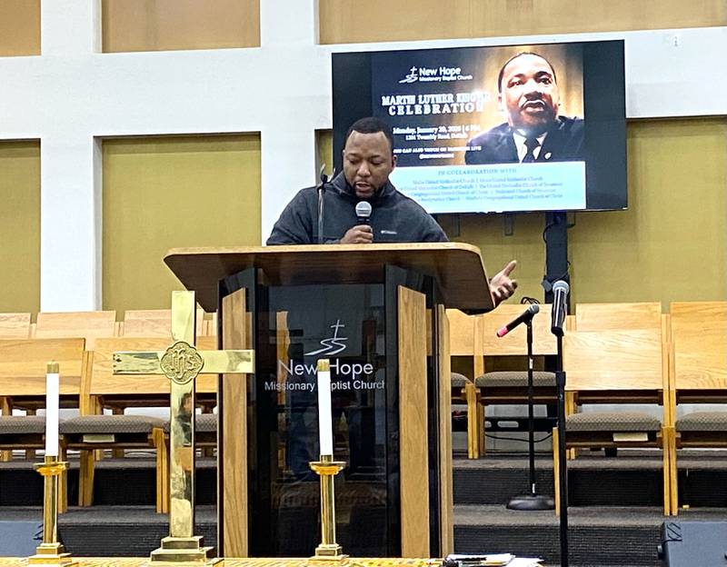 Minister Argyle O'Leary, of New Hope Missionary Baptist Church, reads details about the life of the Rev. Martin Luther King, Jr., during the annual MLK Day celebration event held Monday, Jan. 20, 2025, at New Hope, 1201 Twombly Road, DeKalb.