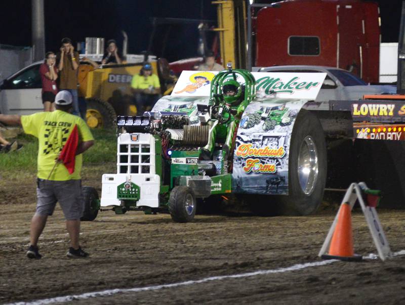 Austin Dornbush of Albany starts Time Maker, a 2021 modified entry, in the 650 open division of the Illini Truck & Tractor Pulls at the Ogle County Fair on Thursday, Aug. 1, 2024.