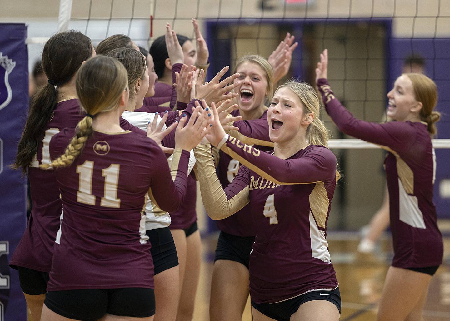 Morris celebrates their two-set win over Sterling Tuesday, Oct. 29, 2024, at the class 3A regional semifinal in Dixon.