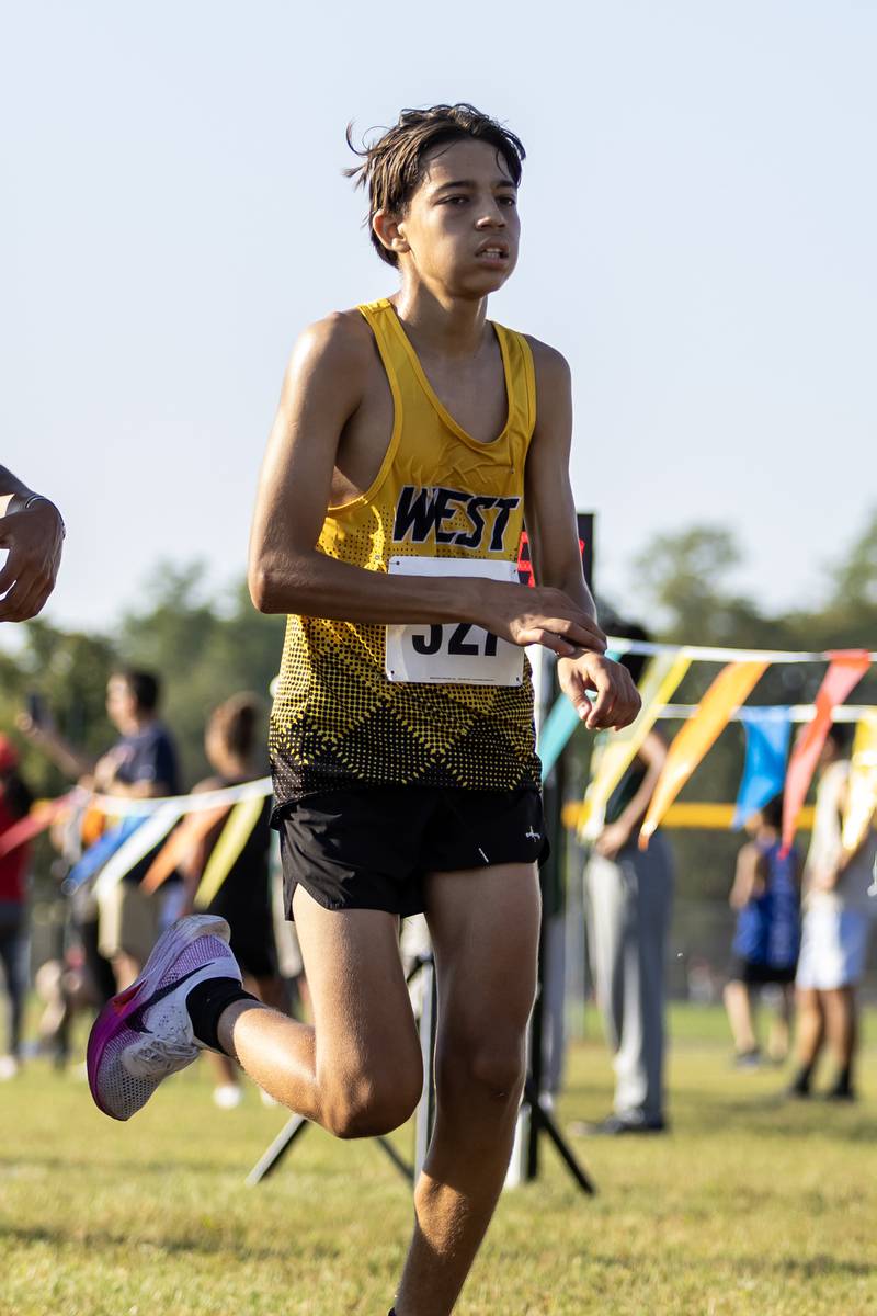 Joliet West’s Emiliano Vieyra finishes the Locktoberfest three-mile varsity cross country race at Dellwood Park in Lockport on October. 4, 2025.